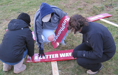 putting the banners on with a staple gun